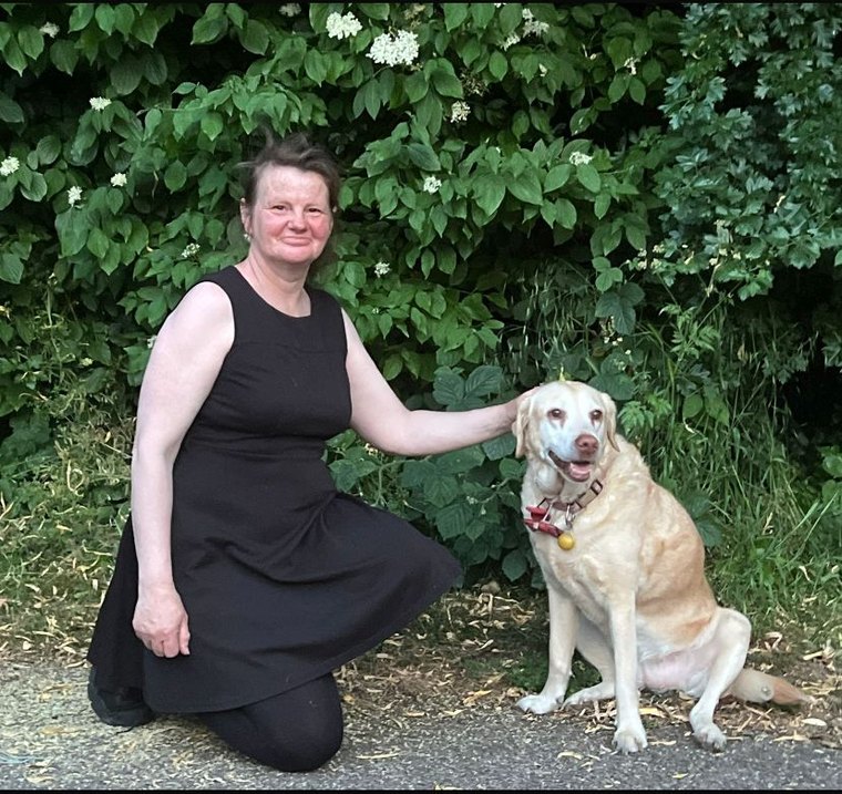 Heather with Olly, her yellow Labrador